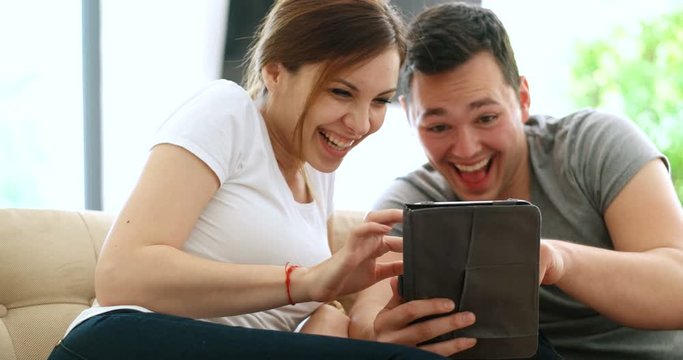 Young Couple using interent on digital tablet
