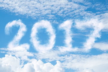 Bright blue sky with clouds. Clouds appear as 2017 numbers in the sky.