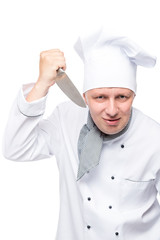 a man in a suit chefs with a sharp knife on a white background