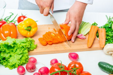 heap of vegetables at the white table for a tasty salad