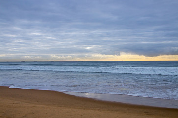  Beach and Ocean Against Cloudy Sky on Horizon
