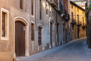 Fototapeta na wymiar Narrow street in the historic centre of Vic, Catalonia, Spain