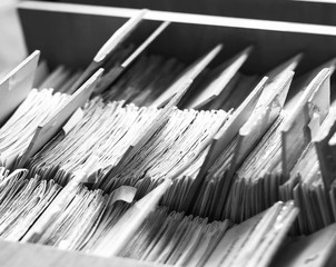 Fototapeta premium File folders in a file cabinet, card catalog in a library, closeup