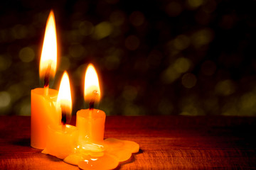 three light candle burning