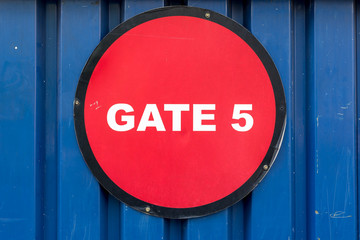 Bright red Gate No 5 sign