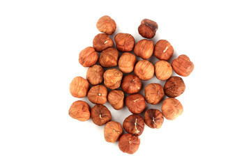 peeled hazelnuts isolated on white background