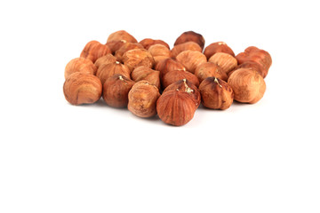 peeled hazelnuts isolated on white background