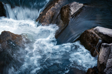 Water flows between stones