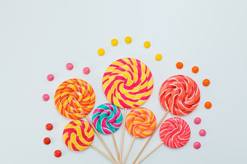 Fancy bouquet of lollipop sweet candy on white background.