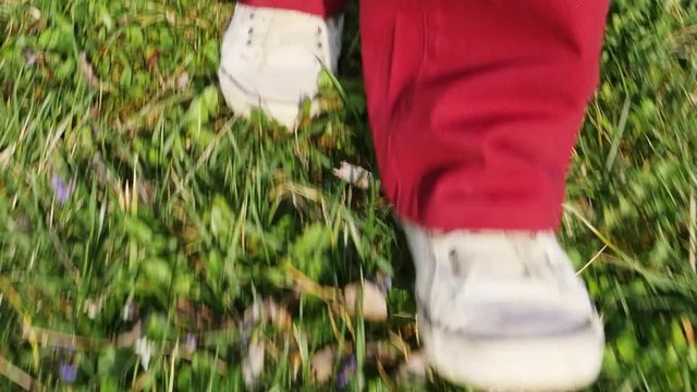Close-up of feets of a man walking, slow motion