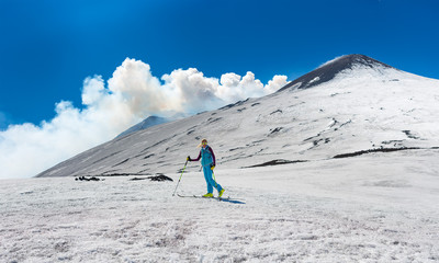 Girl ski touring under the top of the crater of Mount Etna © michelangeloop
