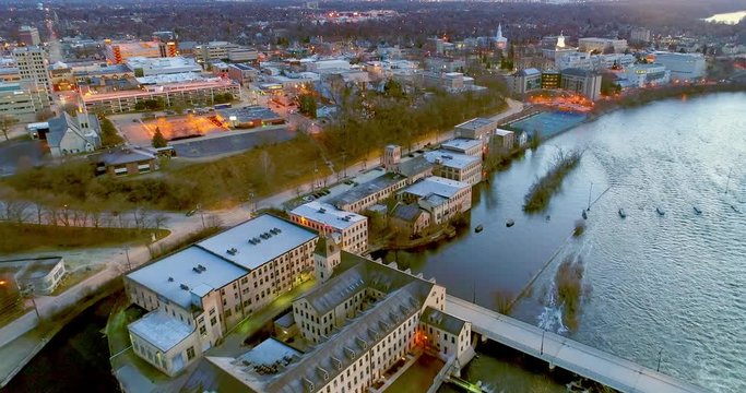 Stunning twilight aerial view of historic waterfront buildings, bridge, in Appleton, Wisconsin.