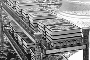 Quran in the mosque lies on the shelves stacks of the book of the Muslim religion, Islamic books for sale, Arabic Religion