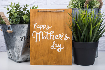 Wooden board with text happy mother's day