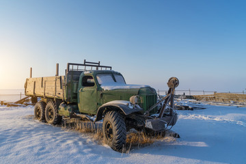 Russian old truck covered by snow in the winter. Baikal lakeI, Russia
