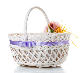 Fototapeta na wymiar basket decorated with flowers isolated on white