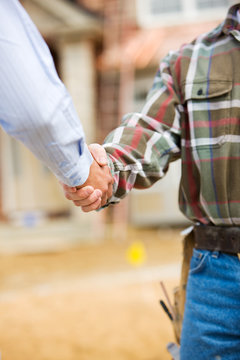 Construction: Agent and Contractor Shake Hands