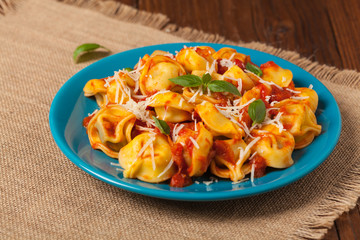 Delicious tortellini with meat in tomato sauce.
