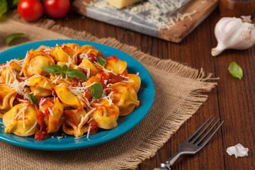 Delicious tortellini with meat in tomato sauce.