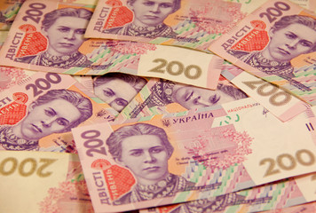 Fototapeta na wymiar Ukrainian money. Background of the two hundred hryvnia banknotes