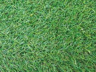Background texture with fake grass top view.
