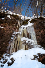 Fototapeta na wymiar Small frozen waterfall