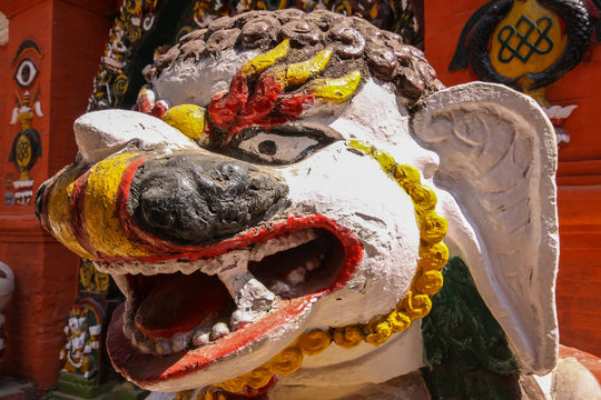 Close up Sculpture head guarding Hindu temple, Durbar Square, Kathmandu, Nepal