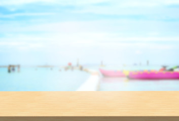 Laminate table top on blurred seascape background can put or montage your products