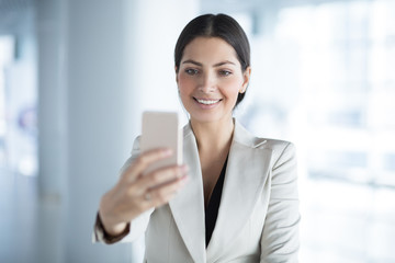 Pretty Business Lady Taking Selfie on Smartphone