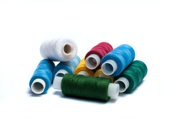 Colored spools of thread isolated on a white background