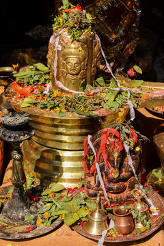 Temple statues with sacrificial offerings, Manakamana Temple, Nepal