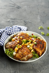 Chicken drumstick with fruit salsa
