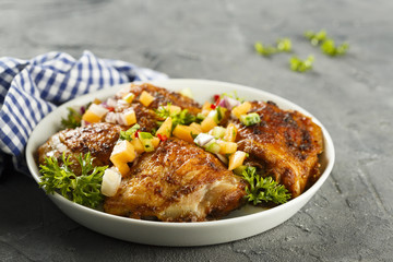 Chicken drumstick with fruit salsa
