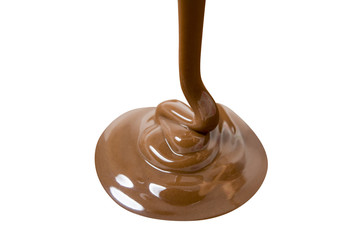 Melted hot chocolate is pouring. Isolated on white