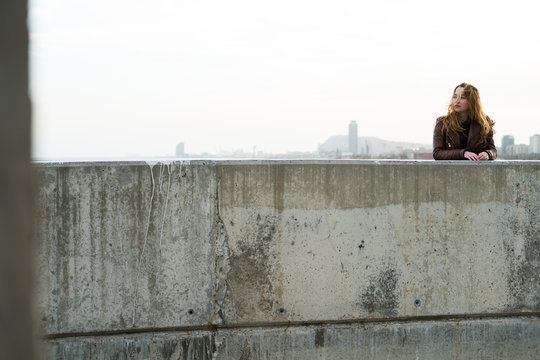 Young girl at the concrete block
