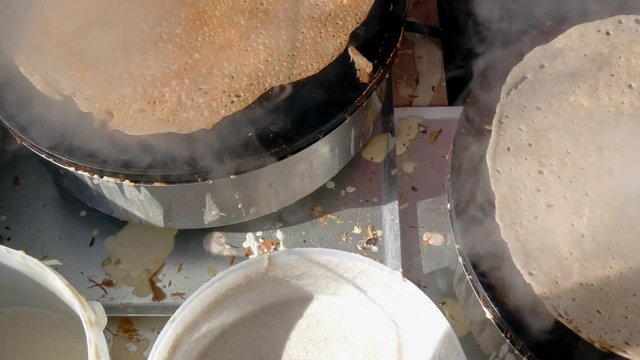4K close up of a buckwheat crepe getting brown. A crepe, or buckwheat pancake, in his cr&ecirc;perie restaurant, in Brittany. Galette bretonne, creperie, Rennes, Bretagne, France. traditional food specialty
