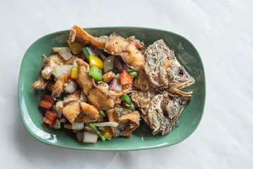 Thai style food, fried Snapper fish with sweet sauce and vegetable.