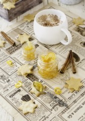 cup of aromatic cappuccino with cookies, orange marmalade. selective focus