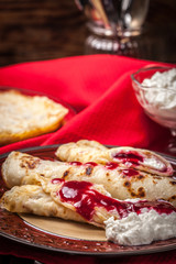 Rolled crepes stuffed with cottage cheese.