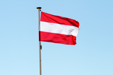 Flag of French Polynesia in the wind and sky