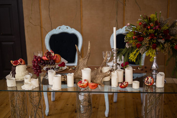 Beautiful decorated wedding table with two vintage chairs