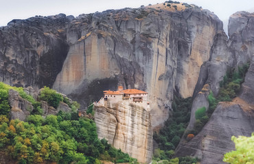 Panoramic view of Meteora monastery on the high rock in the mountains at summer time, Greece
