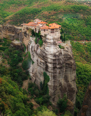 Panoramic view of Meteora monastery on the high rock in the mountains at summer time, Greece