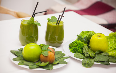 Healthy green smoothie and ingredients - superfoods, detox, diet, health, vegetarian food concept.