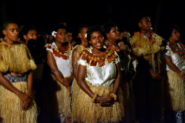 Indigenous Fijian people sing and dance in Fiji