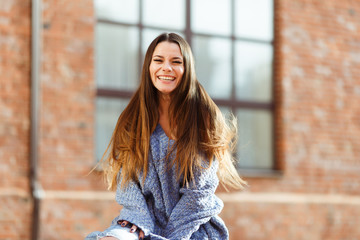 Beautiful girl in blue knitted sweater