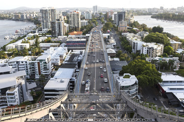  Traffic passing under the southern side of Brisbane Story Bridge with view of Kangaroo Point and...
