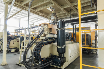 plant for the production of plastic parts. caterpillar mechanism on the factory
