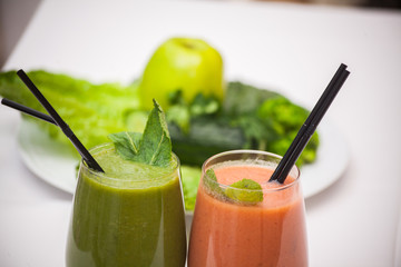 Healthy green and red smoothies and ingredients - superfoods, detox, diet, health, vegetarian food concept