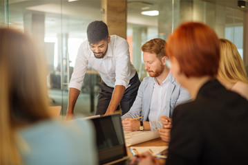 Team of business people having a meeting together.